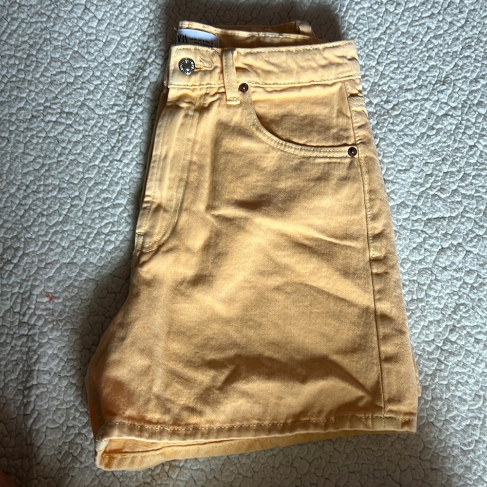 Peach colored shorts from Zara